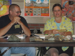 Jason investigates rocks and geological formations during a Wade Institute for Science Education Summer Professional Development Institute.